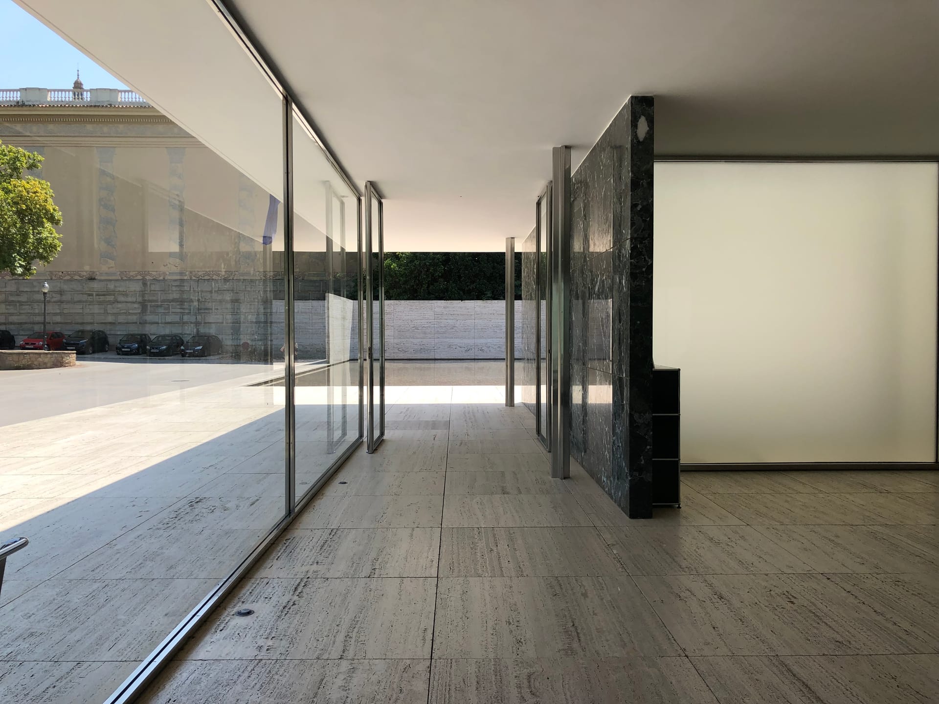 The marble and glass walls carry none of the roof's load; they are structurally independent. New spaces can be made by adjusting their position and length along an axis.

For the exterior that encloses the interior we always used a glass wall along part of it, and arranged the interior walls as single, unbroken rectangular planes.